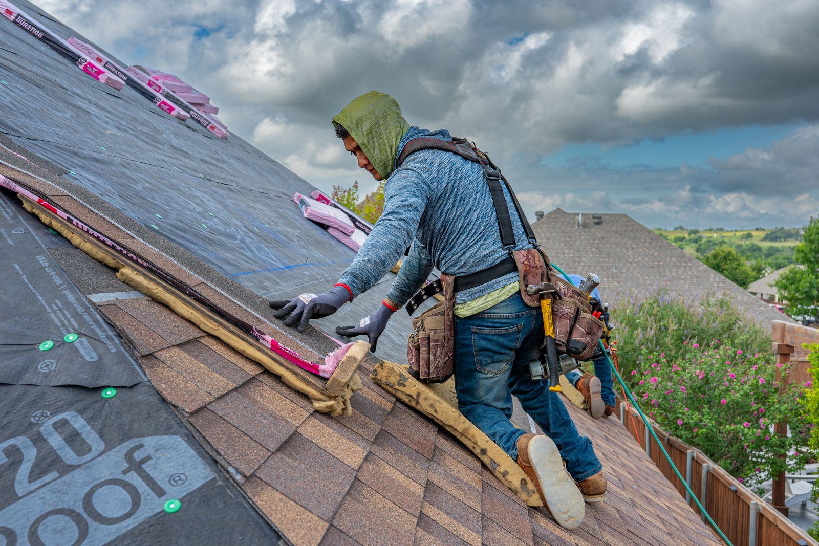 Roofing crew working on a home